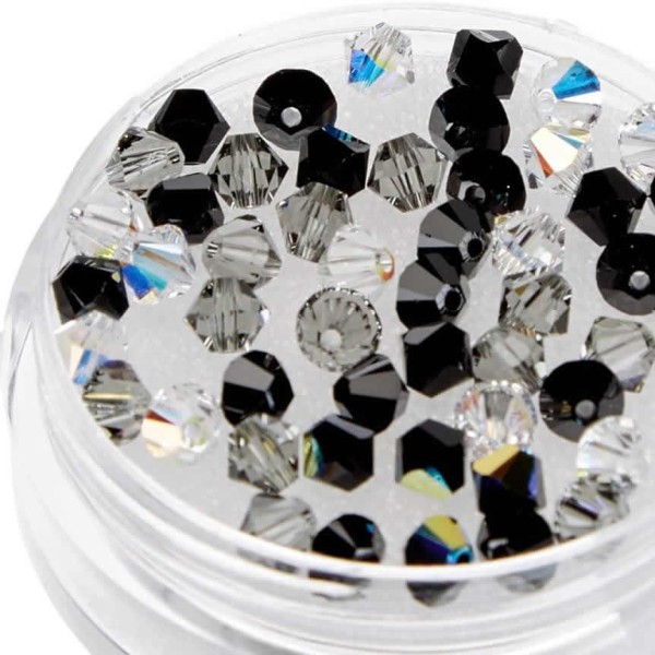 50 Tupies vidrio Swarovski tonos negro-cristal, 4mm